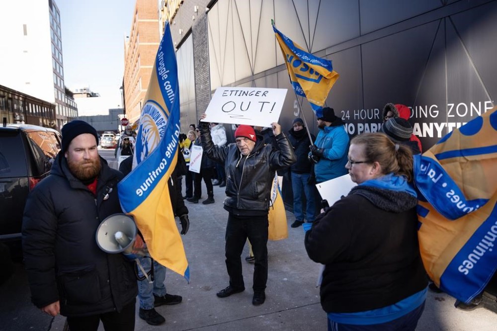 Members and supporters of the Canadian Union of Postal Workers (CUPW) call for the termination of president and CEO of Canada Post Doug Ettinger while rallying outside a speaking engagement by Prime Minister Justin Trudeau in Halifax on Monday, December 9, 2024. THE CANADIAN PRESS/Darren Calabrese