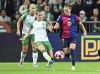 Hammarby's Smilla Vallotto, left, and Barcelona's Ewa Pajor during the Champions League group D women's soccer match between Hammarby IF and FC Barcelona at Stockholm Arena in Stockholm, Sweden, Thursday Dec. 12, 2024. (Jonas Ekströmer/TT via AP)