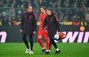 Bayern's Harry Kane leaves the pitch injured during the German Bundesliga soccer match between Borussia Dortmund and Bayern Munich at the Signal-Iduna Park in Dortmund, Germany, Saturday, Nov. 30, 2024. (Federico Gambarini/dpa/dpa via AP)