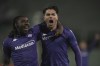 Fiorentina's Riccardo Sottil, right, celebrates with teammate Moise Kean after scoring his side's opening goal during the Europa Conference League opening phase soccer match between Fiorentina and LASK at the Artemio Franchi Stadium in Florence, Italy, Thursday Dec. 12, 2024. (Massimo Paolone/LaPresse via AP)