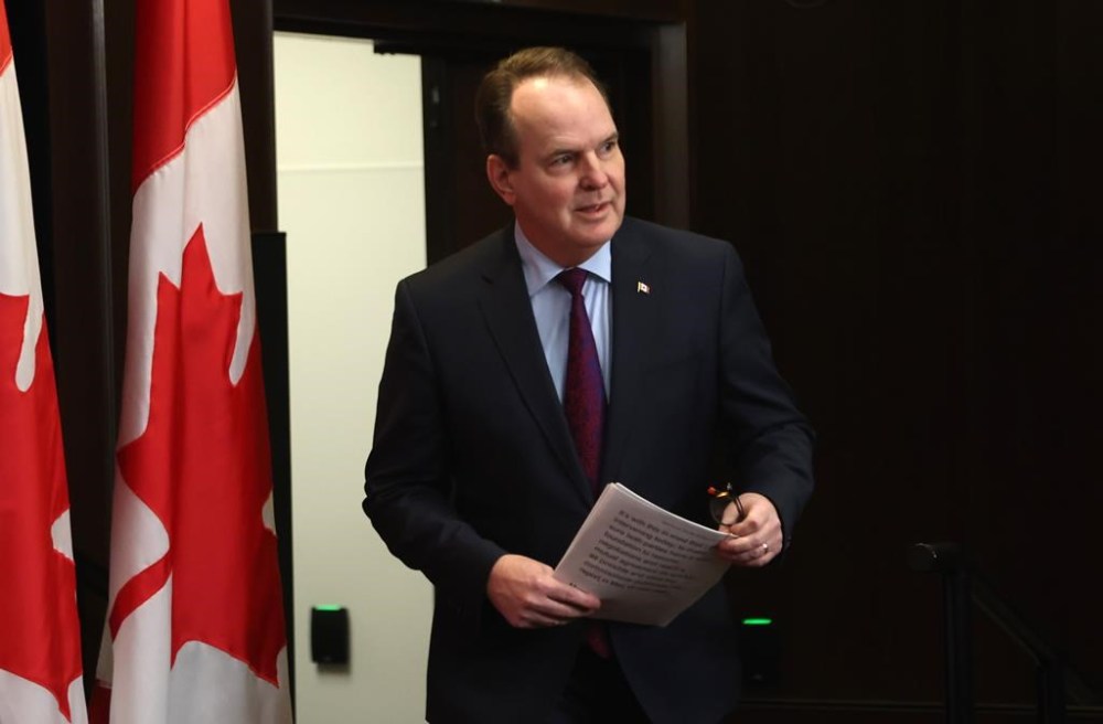 Labour Minister Steven MacKinnon arrives to announce that he is sending the labour dispute between Canada Post and the Canadian Union of Postal Workers (CUPW) to the Canada Industrial Relations Board at a press conference in Ottawa on Friday, Dec. 13, 2024. THE CANADIAN PRESS/ Patrick Doyle