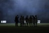 FILE - Vancouver Whitecaps players are silhouetted as smoke from pyrotechnics hangs in the air before Game 2 against Los Angeles FC in the first round of the MLS Cup soccer playoffs in Vancouver, British Columbia, Nov. 3, 2024. (Darryl Dyck/The Canadian Press via AP, File)