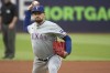 FILE - Texas Rangers starting pitcher Nathan Eovaldi delivers against the Cleveland Guardians during the first inning of a baseball game in Cleveland, Friday, Aug. 23, 2024. (AP Photo/Phil Long, File)