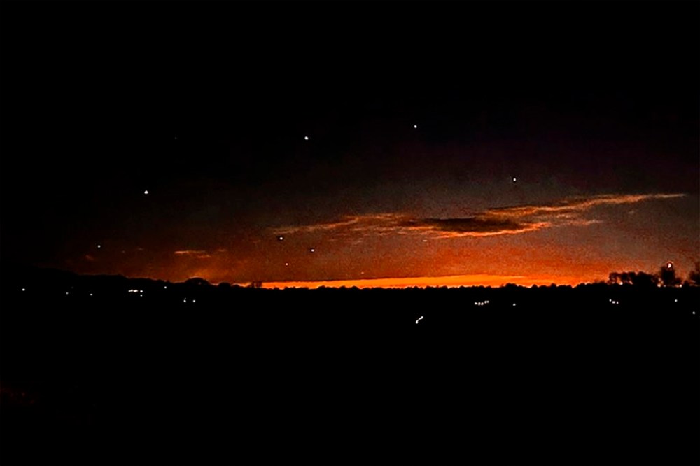This photo provided by Trisha Bushey shows the evening sky and points of light near in Lebanon Township, N.J., on Thursday, Dec. 5, 2024. (Trisha Bushey via AP)