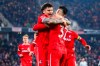 Freiburg's Lukas Kübler, left, celebrates scoring with teammate Vincenzo Grifo during the Bundesliga soccer. match between SC Freiburg and VfL Wolfsburg at Europa-Park Stadium in Freiburg, Germany, Friday Dec. 13, 2024. (Tom Weller/dpa via AP)