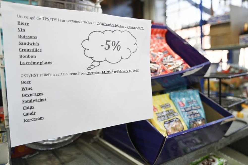 A sign advertising no GST 5% sales tax on certain products is shown at a convenience store in Montreal, Saturday, December 14, 2024. A two-month break from the federal GST takes effect today. THE CANADIAN PRESS/Graham Hughes