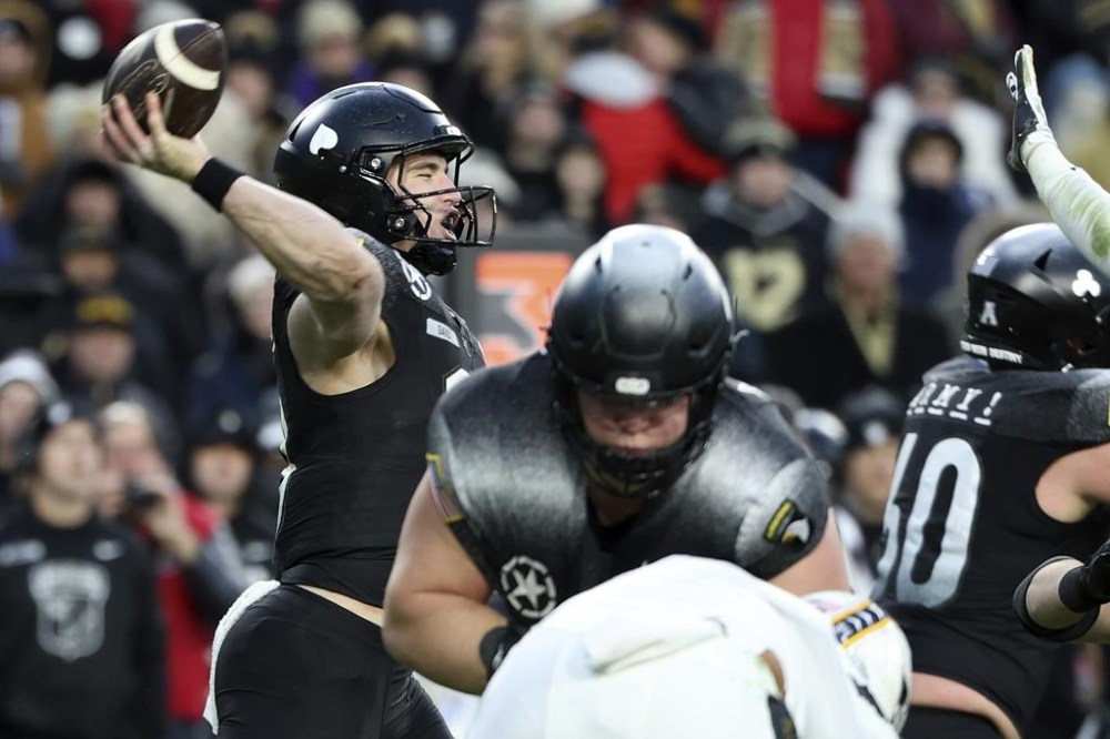 Army quarterback Bryson Daily (13) throws a pass during the second half of an NCAA college football game against Navy, Saturday, Dec. 14, 2024, in Landover, Md. (AP Photo/Daniel Kucin Jr.)