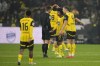 Dortmund's Karim Adeyemi, second right, argues with the referee after receiving a yellow card during the German Bundesliga soccer match between Borussia Dortmund and TSG Hoffenheim at the Signal-Iduna Park in Dortmund, Germany, Sunday, Dec. 15 2024. (AP Photo/Martin Meissner)
