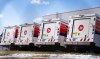Canada Post trucks are seen in a distribution centre in Montreal on December 13, 2024. THE CANADIAN PRESS/Christinne Muschi