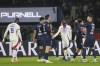 Lyon's Ainsley Maitland-Niles, center, and Lyon's Moussa Niakhate react at the end of the French League One soccer match between Paris Saint-Germain and Lyon at the Parc des Princes in Paris, Sunday, Dec. 15, 2024. (AP Photo/Aurelien Morissard)