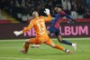 Barcelona's Lamine Yamal, right, and Leganes' goalkeeper Marko Dmitrovic challenge for the ball during the Spanish La Liga soccer match between Barcelona and Leganes at the Lluis Companys Olympic Stadium in Barcelona, Spain, Sunday, Dec. 15, 2024. (AP Photo/Joan Monfort)