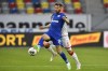 FILE - Schalke's Guido Burgstaller, left, is challenged by Duesseldorf's Andre Hoffman during the German Bundesliga soccer match between Fortuna Duesseldorf and FC Schalke 04 in Duesseldorf, Germany, on May 27, 2020. (AP Photo/Martin Meissner, Pool, File)