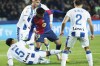 Barcelona's Lamine Yamal, centre, and Leganes' Renato Tapia, bottom challenge for the ball during the Spanish La Liga soccer match between Barcelona and Leganes at the Lluis Companys Olympic Stadium in Barcelona, Spain, Sunday, Dec. 15, 2024. (AP Photo/Joan Monfort)