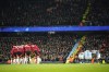 Manchester City and Manchester United, left, teams huddle just prior to kick off of the English Premier League soccer match between Manchester City and Manchester United at the Etihad Stadium in Manchester, Sunday, Dec. 15, 2024. (AP Photo/Dave Thompson)