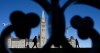 People are silhouetted as buildings cast their shadows in front of the Peace tower on Parliament Hill, in Ottawa, Wednesday, Nov. 27, 2024. THE CANADIAN PRESS/Adrian Wyld