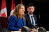 Minister of Housing, Infrastructure and Communities Sean Fraser listens to Deputy Prime Minister and Finance Minister Chrystia Freeland speak during a news conference, Tuesday, Dec. 10, 2024. THE CANADIAN PRESS/Adrian Wyld