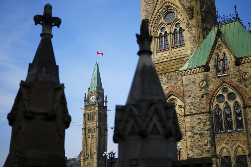 The Canadian flag flies atop the Peace Tower on Parliament Hill in Ottawa on Wednesday, Oct. 30, 2024. THE CANADIAN PRESS/Sean Kilpatrick