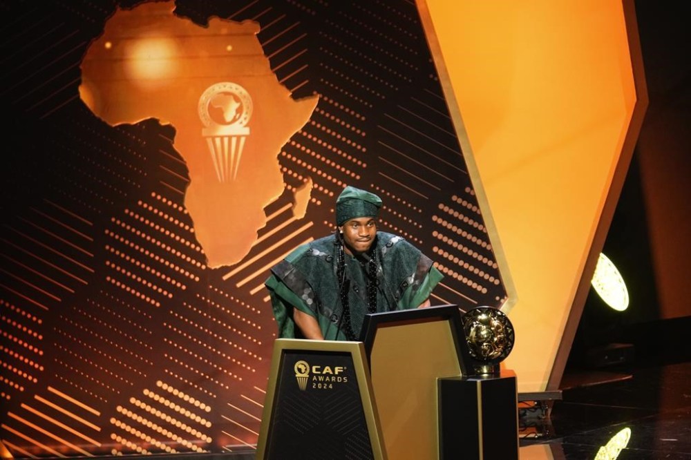 Nigeria's Ademola Lookman receives the 2024 CAF African Footballer of the Year award, in Marrakech, Morocco Monday, Dec. 16, 2024 (AP Photo/Mosa'ab Elshamy)