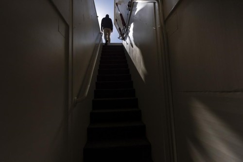 The owner, who asked not to be identified because of concerns about his privacy, walks up the steps of his underground shelter in an undisclosed Southern California city, on Dec. 16, 2024. (AP Photo/Jae C. Hong)