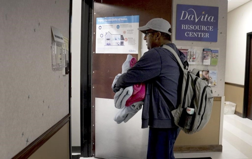 Alex Berrios walks into his dialysis session in Louisville, Ky., on Oct. 4, 2024. (AP Photo/Shelby Lum)