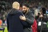 Manchester City's head coach Pep Guardiola, left, and Manchester United's manager Rúben Amorim meet ahead the English Premier League soccer match between Manchester City and Manchester United at the Etihad Stadium in Manchester, Sunday, Dec. 15, 2024. (AP Photo/Dave Thompson)