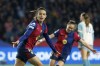 Barcelona's Aitana Bonmati, left, celebrates after scoring her side's second goal during the women's Champions League group D soccer match between FC Barcelona and Manchester City at the Olympic Stadium in Barcelona, Spain, Wednesday, Dec. 18, 2024. (AP Photo/Joan Monfort)