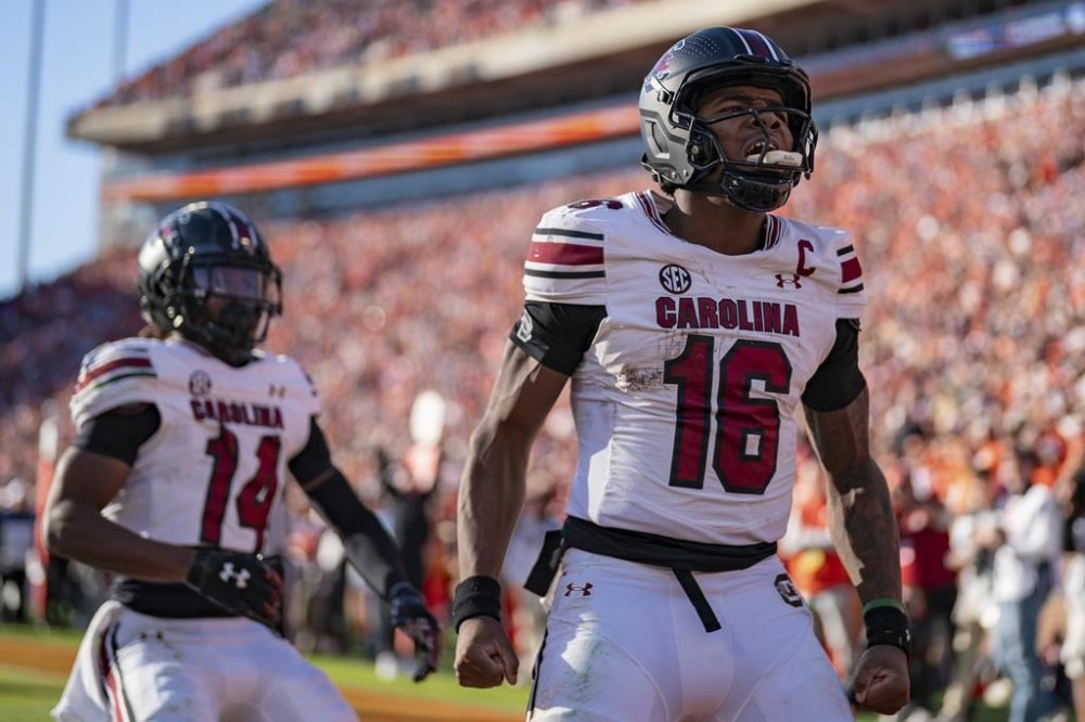 FILE - South Carolina quarterback LaNorris Sellers (16) reacts after scoring a touchdown in the second half of an NCAA college football game against Clemson, Saturday, Nov. 30, 2024, in Clemson, S.C. (AP Photo/Jacob Kupferman, FIle)
