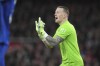 Everton's goalkeeper Jordan Pickford reacts during the English Premier League soccer match between Arsenal and Everton at Emirates Stadium in London, Saturday, Dec. 14, 2024. (AP Photo/Kin Cheung)