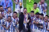 FILE - Argentina's Lionel Messi holds the trophy aloft as he celebrates with his team at the end of the World Cup final soccer match between Argentina and France at the Lusail Stadium in Lusail, Qatar, Sunday, Dec. 18, 2022. (AP Photo/Hassan Ammar, File)