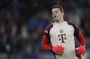 FILE - Bayern's goalkeeper Manuel Neuer stretches himself during warm up before the Champions League opening phase soccer match between FC Bayern and Paris Saint Germain, at the Allianz Arena in Munich, Germany, Tuesday, Nov. 26, 2024. (AP Photo/Matthias Schrader, File)