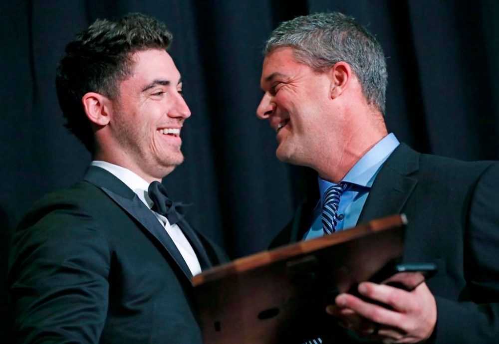 FILE - National League Rookie of the Year Cody Bellinger, left, of the Los Angeles Dodgers, receives his award from his father Clay Bellinger during the New York Chapter of the Baseball Writers' Association of America annual dinner in New York, Sunday, Jan. 28, 2018. (AP Photo/Kathy Willens, File)