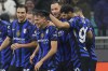 Inter Milan's Kristjan Asllani, center, celebrates with teammates after scoring their second goal during the Italian Cup round of 16 soccer match between Inter Milan and Udinese at SanSiro Stadium in Milan, Italy, Wednesday, Dec. 19, 2024. (Spada/LaPresse via AP)