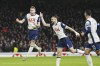 Tottenham's Dejan Kulusevski, left, celebrates after scoring his side's second goal during the English League Cup quarter-final soccer match between Tottenham and Manchester United, at the Tottenham Hotspur Stadium in London, Thursday, Dec. 19, 2024. (AP Photo/Dave Shopland )