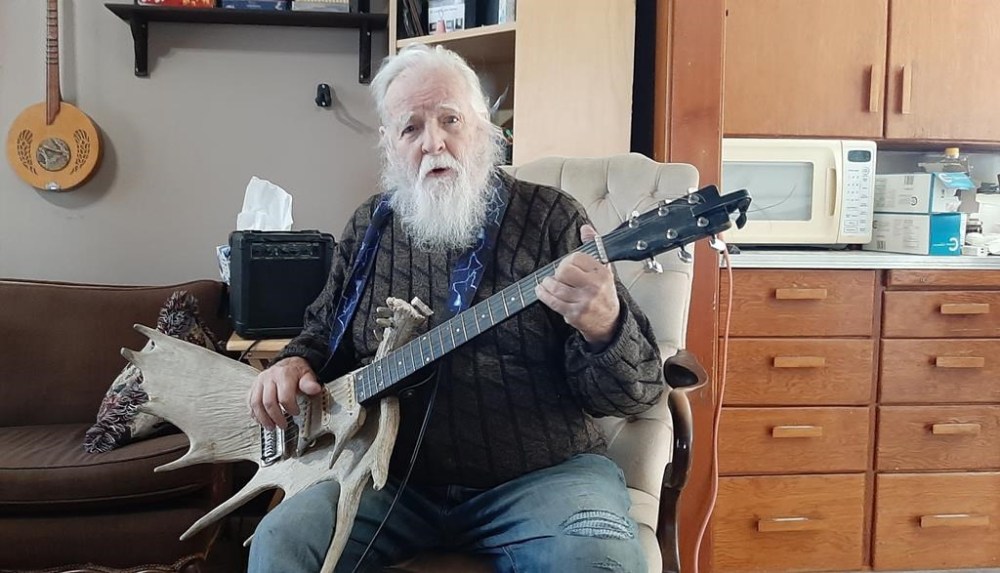 Lorne Collie holds a guitar made from a moose antler at his home in Hope, B.C. in this Wednesday, Dec. 18, 2024, handout photo. THE CANADIAN PRESS/HO, James Collie *MANDATORY CREDIT*