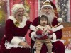 Santa and Mrs. Claus talk to a child in Yakutat, Alaska, in the Alaska National Guard's Operation Santa program, Wednesday, Dec. 18, 2024. (AP Photo/Mark Thiessen)