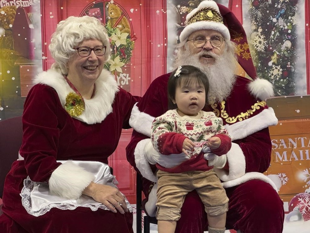 Santa and Mrs. Claus talk to a child in Yakutat, Alaska, in the Alaska National Guard's Operation Santa program, Wednesday, Dec. 18, 2024. (AP Photo/Mark Thiessen)