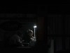 A nail technician gives a manicure lit by a rechargeable light bulb during a power outage in Quito, Ecuador, Wednesday, Dec. 11, 2024, amid an energy crisis and blackouts that the government has attributed to a drought. The government of President Daniel Noboa suspended daily power cuts during the end-of-year holidays. (AP Photo/Dolores Ochoa)
