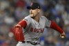 FILE - Boston Red Sox relief pitcher Cam Booser throws during the seventh inning of a baseball game against the Kansas City Royals, Aug. 6, 2024, in Kansas City, Mo. (AP Photo/Reed Hoffmann, File)