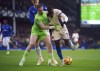 Everton goalkeeper Jordan Pickford and Chelsea's Nicolas Jackson (right) battle for the ball during the English Premier League match soccer match between Everton and Chelsea, at Goodison Park, Liverpool, England, Sunday Dec. 22, 2024. (Peter Byrne/PA via AP)