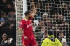Liverpool's Mohamed Salah celebrates after scoring his side's fourth goal during the English Premier League soccer match between Tottenham and Liverpool at Tottenham Hotspur Stadium in London, Sunday, Dec. 22, 2024. (AP Photo/Dave Shopland)