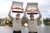 Bernhard Langer, right, and his son Jason Langer hold the championship belts after winning the PNC Championship golf tournament, Sunday, Dec. 22, 2024, in Orlando, Fla. (AP Photo/Phelan M. Ebenhack)