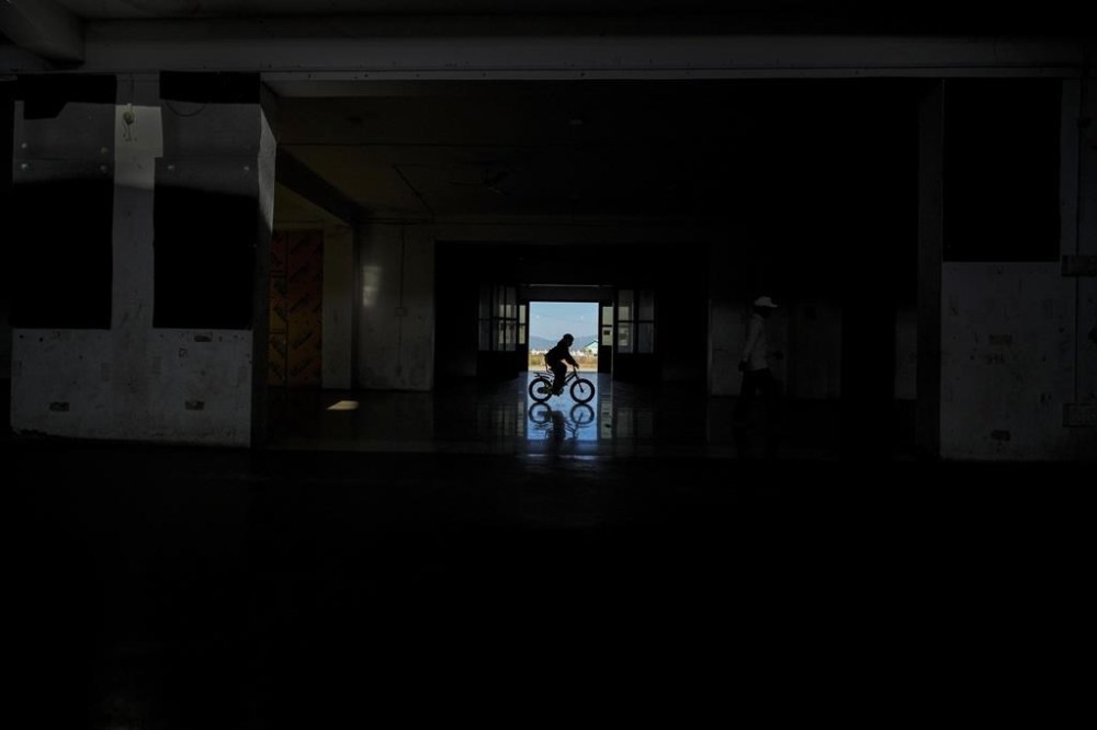 A Meitei boy rides on a bicycle in a relief camp in Imphal, Manipur, Monday, Dec. 16, 2024. (AP Photo/Anupam Nath)