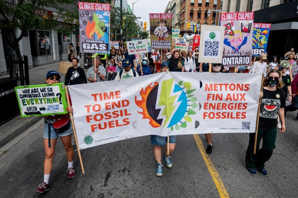 A historic youth-led challenge of the Ontario government's climate plan is a step closer to a hearing before Canada's highest court. Protesters take part in a climate protest march in Ottawa, on Saturday, Sept. 21, 2024. THE CANADIAN PRESS/Spencer Colby