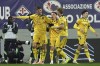 Udinese's Lorenzo Lucca, left, celebrates after scoring during the Italian Serie A soccer match between Fiorentina and Udinese, Artemio Franchi Stadium in Florence, Italy, Monday Dec. 23, 2024 (Massimo Paolone/LaPresse via AP)