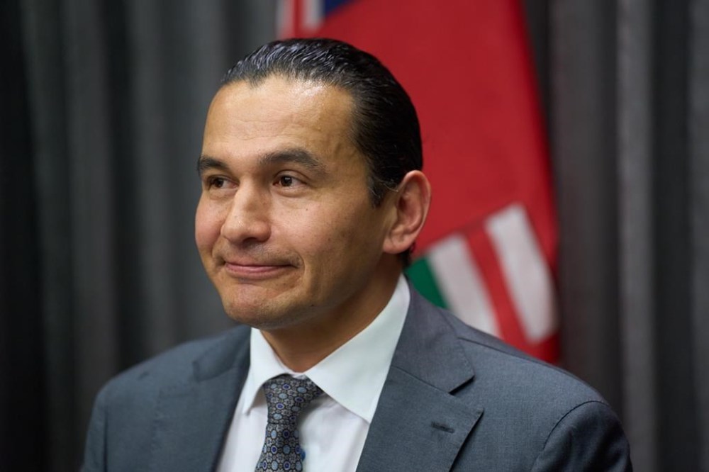 Manitoba Premier Wab Kinew speaks to the media at the Manitoba Legislative Building in Winnipeg on Tuesday, Nov.19, 2024. Kinew's popularity shows little sign of waning more than a year after he led the provincial New Democrats to power, but there are some tough choices ahead as he tries to fulfil promises to improve health care, address poverty and get the government's finances in order.THE CANADIAN PRESS/David Lipnowski