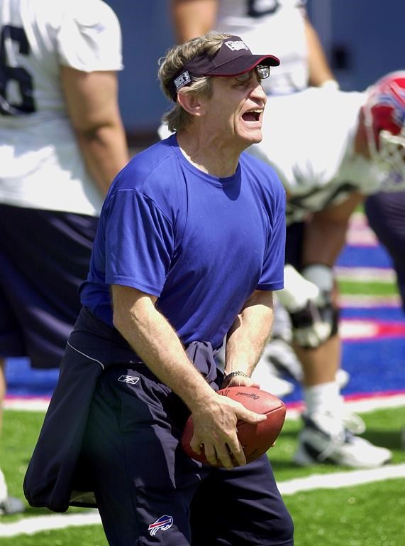 FILE - Buffalo Bills offensive-line coach Jim McNally voices his displeasure on player's blocking scheme during mini-camp practice in Orchard Park, N.Y., May 27, 2004. (AP Photo/Don Heupel, File)