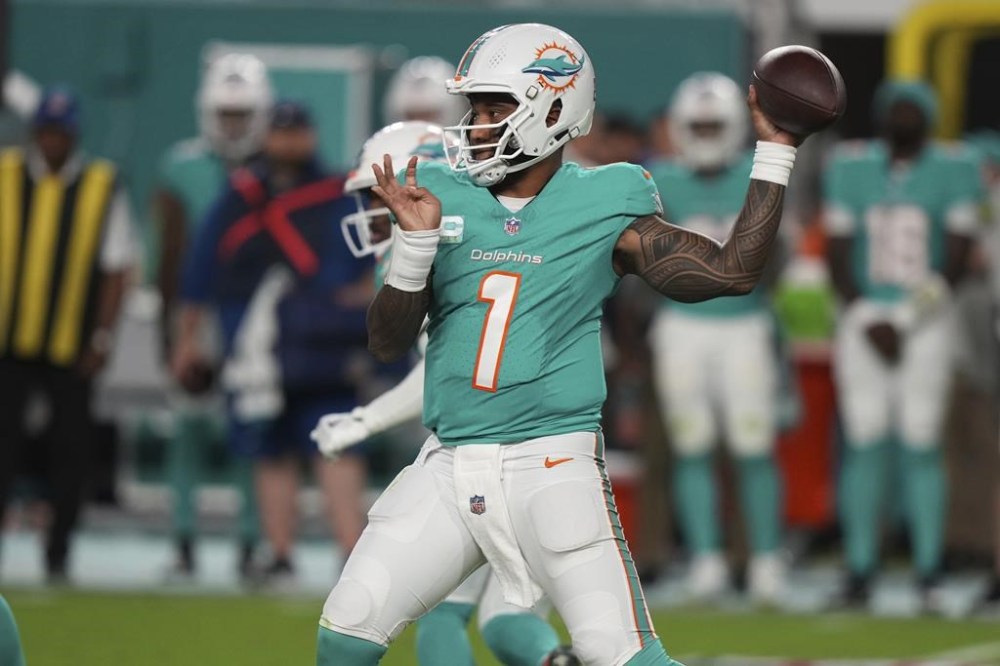 Miami Dolphins quarterback Tua Tagovailoa (1) aims a pass during the first half of an NFL football game against the San Francisco 49ers, Sunday, Dec. 22, 2024, in Miami Gardens, Fla. (AP Photo/Lynne Sladky)