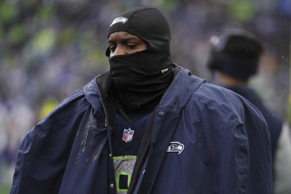 Seattle Seahawks running back Kenneth Walker III (9) walks down the sideline during the first half of an NFL football game against the Minnesota Vikings, Sunday, Dec. 22, 2024, in Seattle. (AP Photo/Lindsey Wasson)