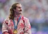 Ethan Katzberg, of Nanaimo, B.C., receives his gold medal in the men's hammer throw event at the 2024 Summer Olympics, in Saint-Denis, France, Monday, Aug. 5, 2024. THE CANADIAN PRESS/Christinne Muschi