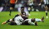 Newcastle United's Fabian Schar, left lays on the pitch after being fouled by Aston Villa's Jhon Duran leading to a red card, during the English Premier League soccer match between Newcastle United and Aston Villa at St. James' Park, in Newcastle upon Tyne, England, Thursday, Dec. 26, 2024. (Owen Humphreys/PA via AP)